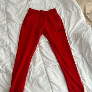 Red Nike joggers
